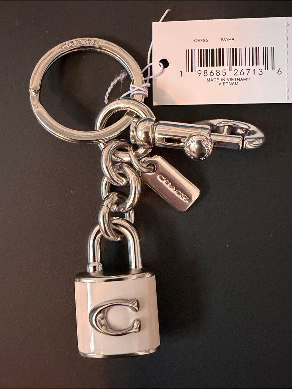 Coach Silver and Cream Enamel Padlock Keychain